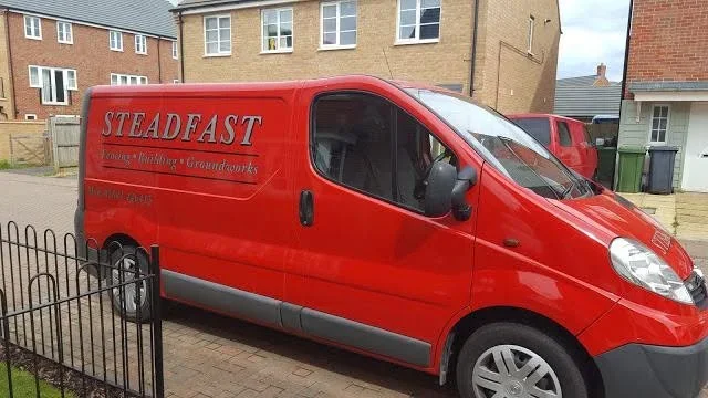 Steadfast Fencing, Building and Groundworks liveried van parked on a Peterborough street